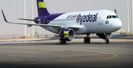 fly a deal airplane landing on the runway of Lahore airport.